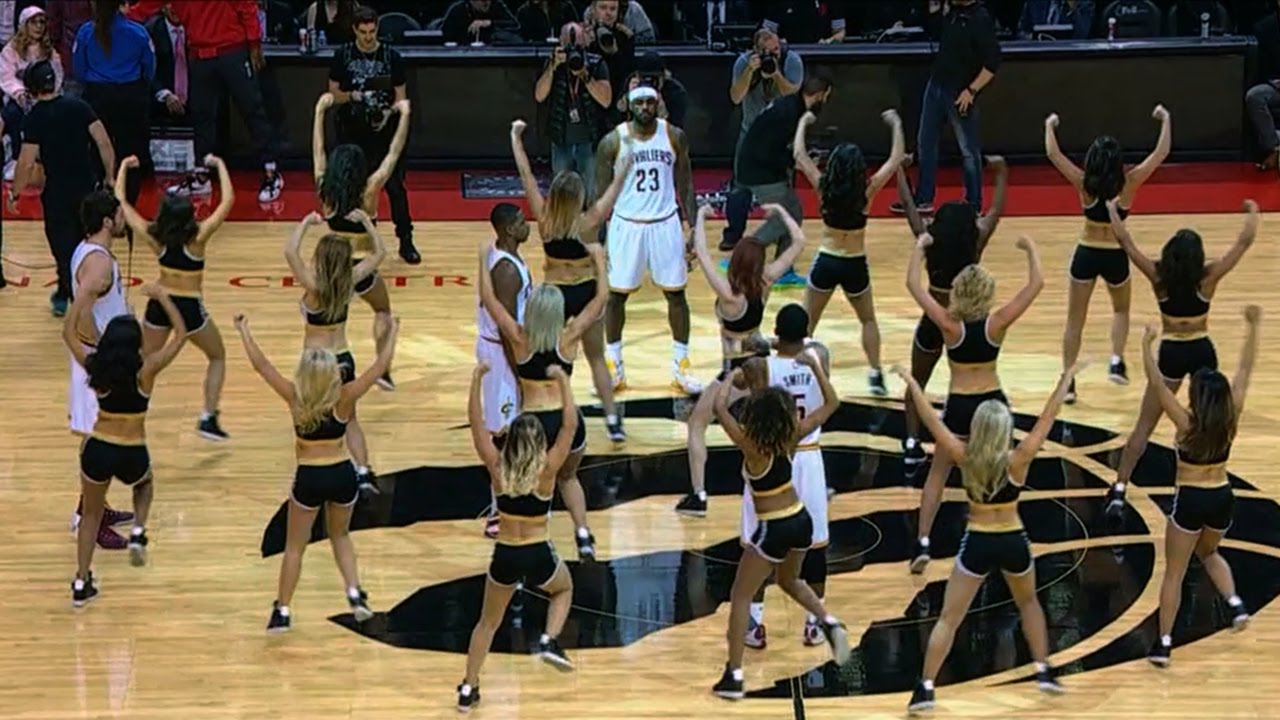 LeBron James and the Cavs surrounded by Toronto Raptors dancers